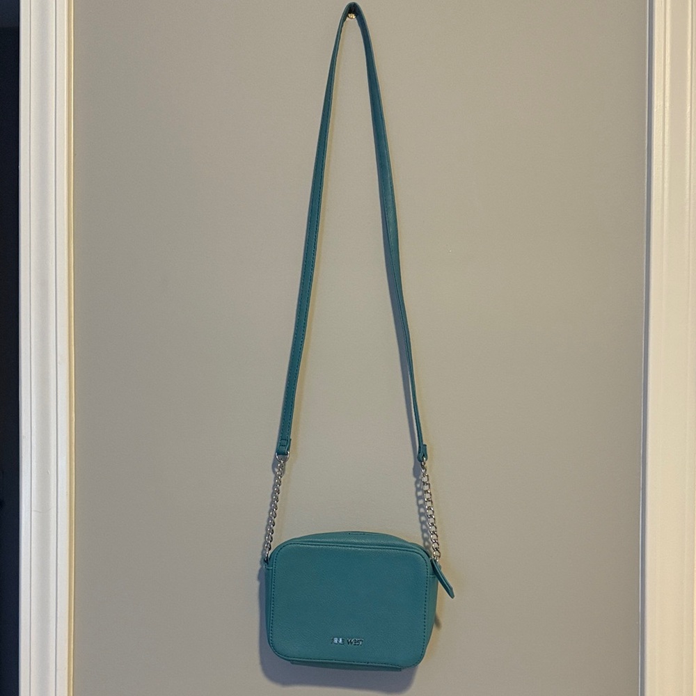 Away Blue Crossbody Bag
4”X 6” Great condition 
One zippered pocket inside